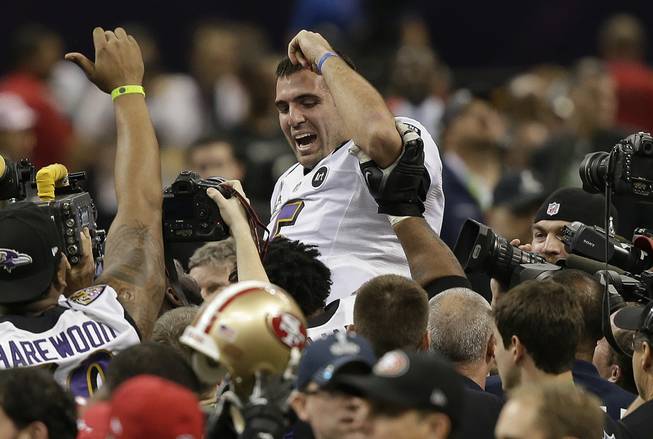 Baltimore Ravens quarterback Joe Flacco (5) is lifted into the air by teammates after defeating the San Francisco 49ers 34-31 in the NFL Super Bowl XLVII football game, Sunday, Feb. 3, 2013, in New Orleans. (AP Photo/Bill Haber)